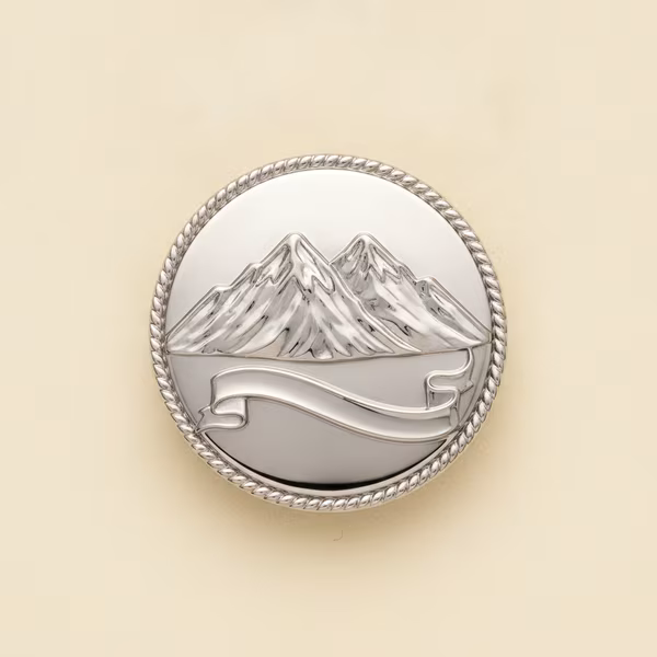 Silver membership badge with twin peaks