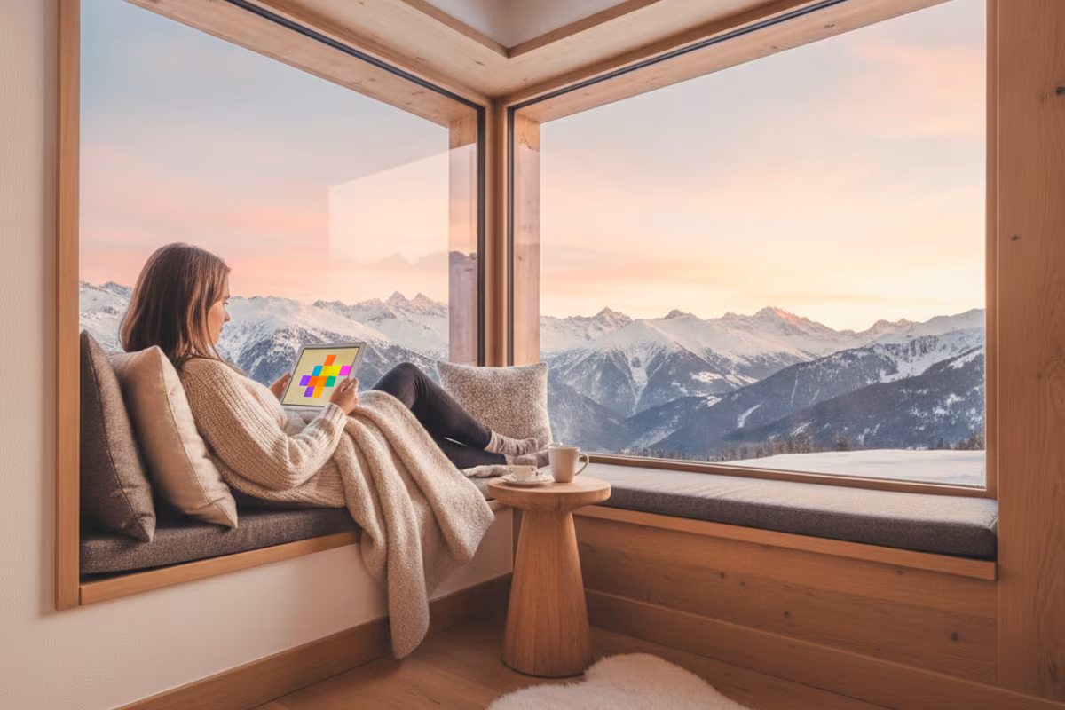 Player relaxing with a tablet game in a timber chalet lounge